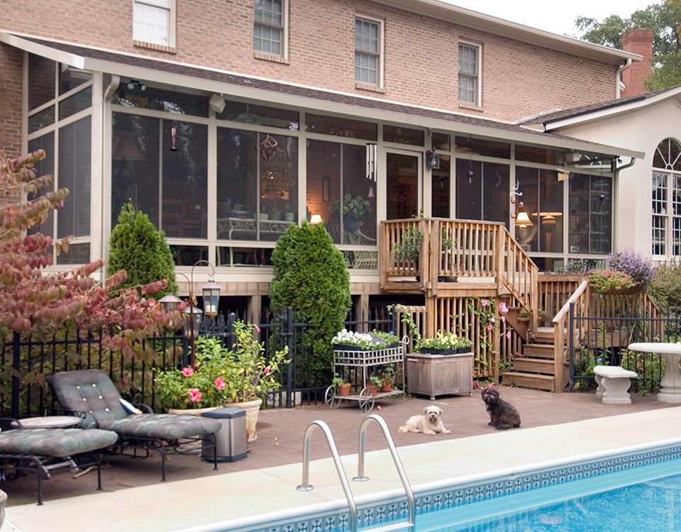 Glass Walled Sun Room Overlooking a Pool