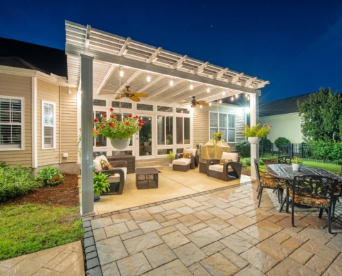 A Backyard Seating Space With White Shade