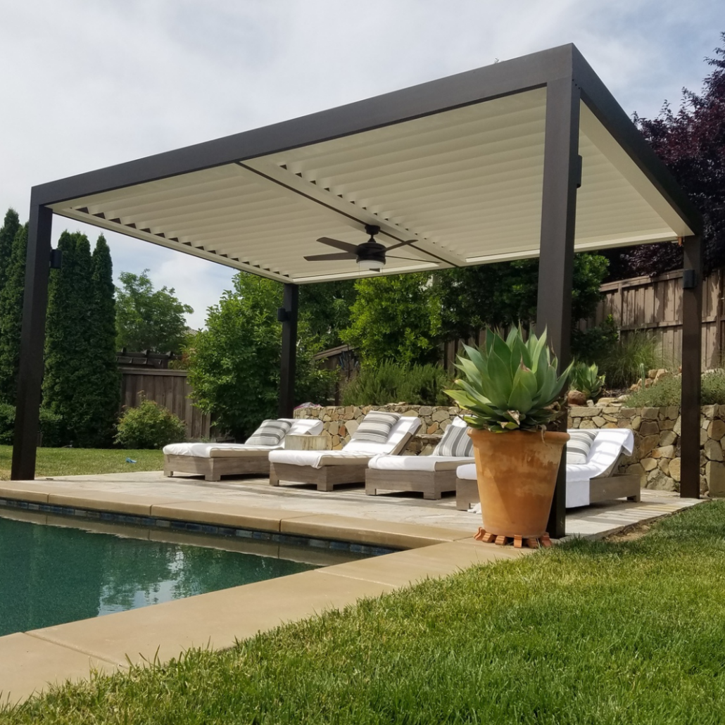 A White Roof Over Pool Chairs by a Pool in a Pool Area